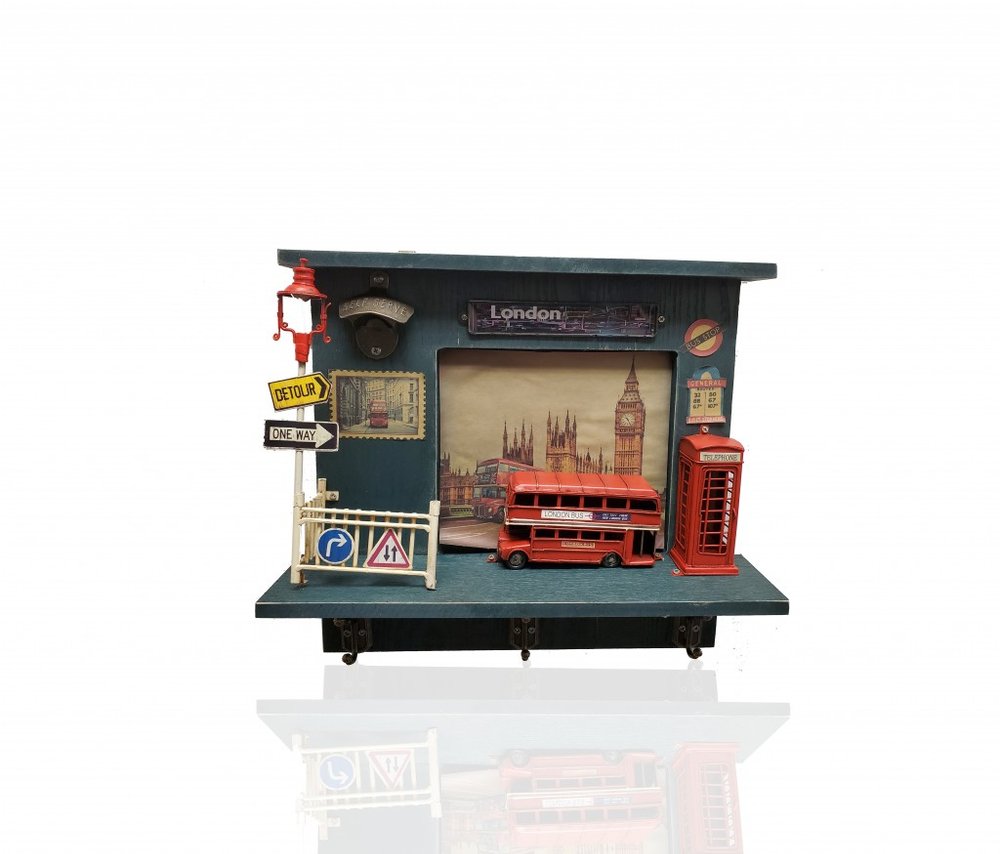 Decorative shelf with London-themed items including a double-decker bus and phone booth.