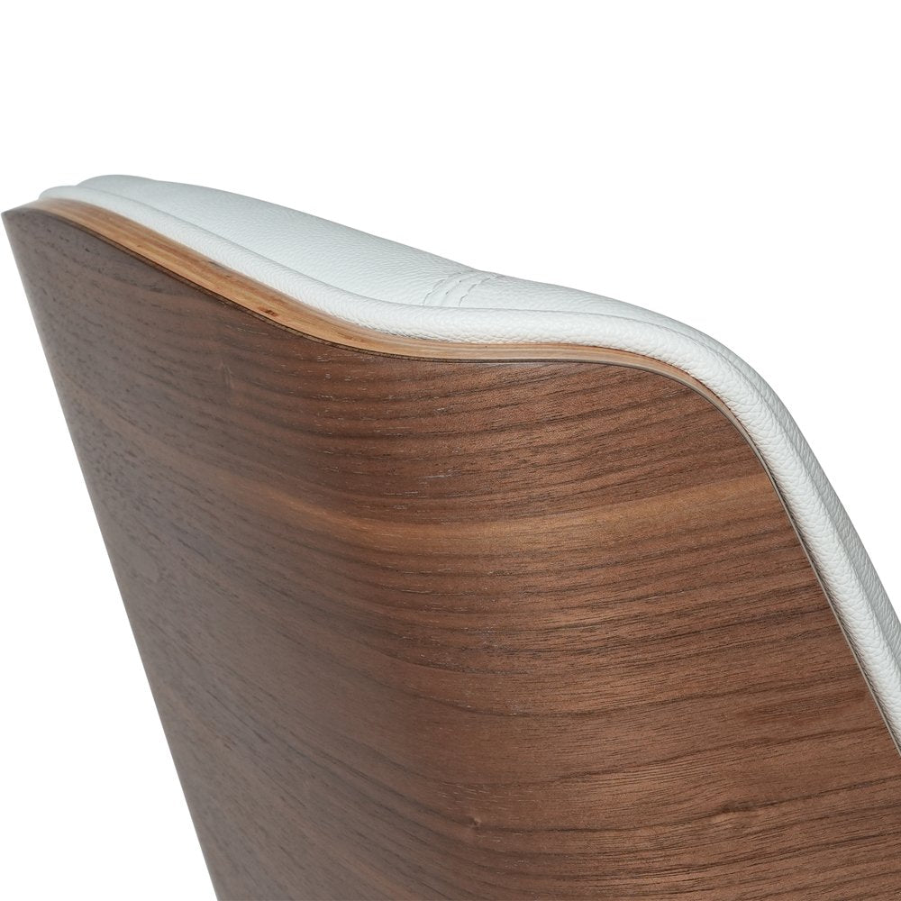 Close-up of a wooden chair with white cushion on a white background